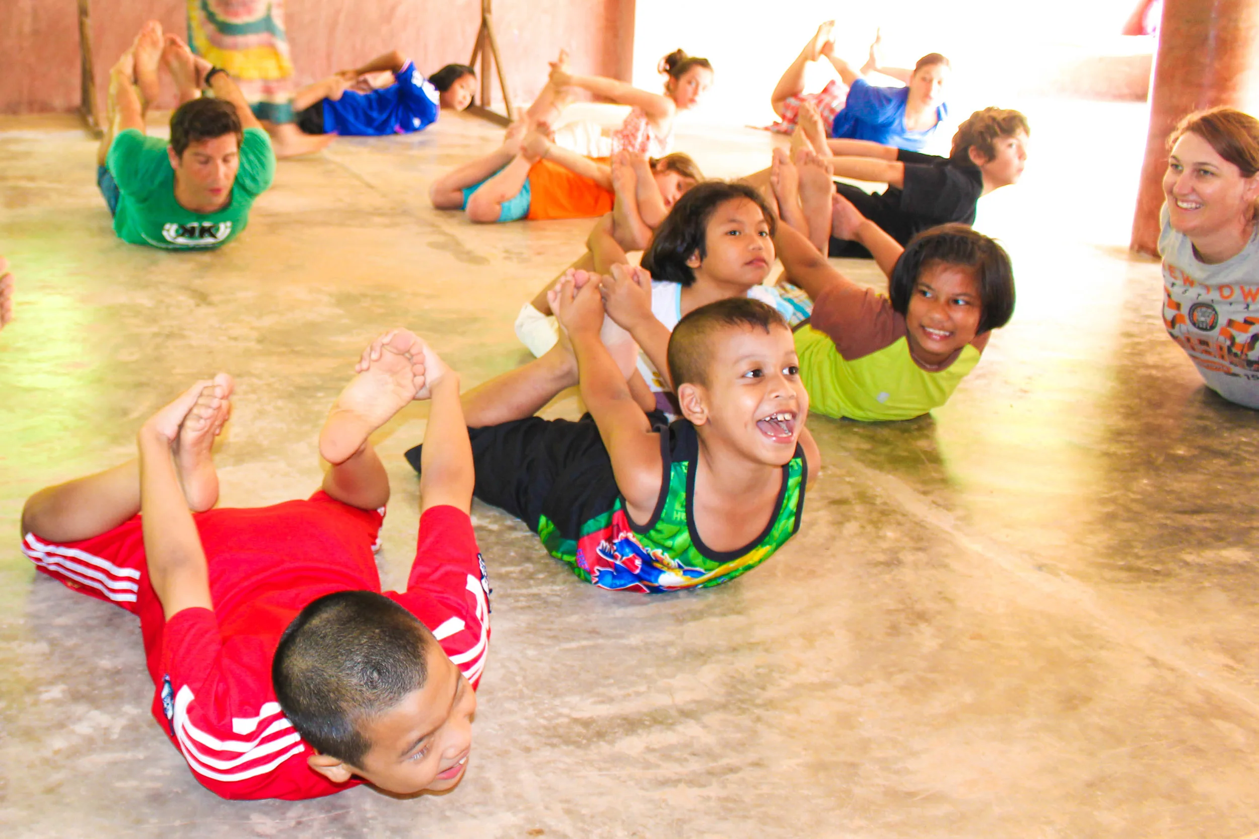 The children of TCDF doing yoga during Saturday Creative School for local children in the community.