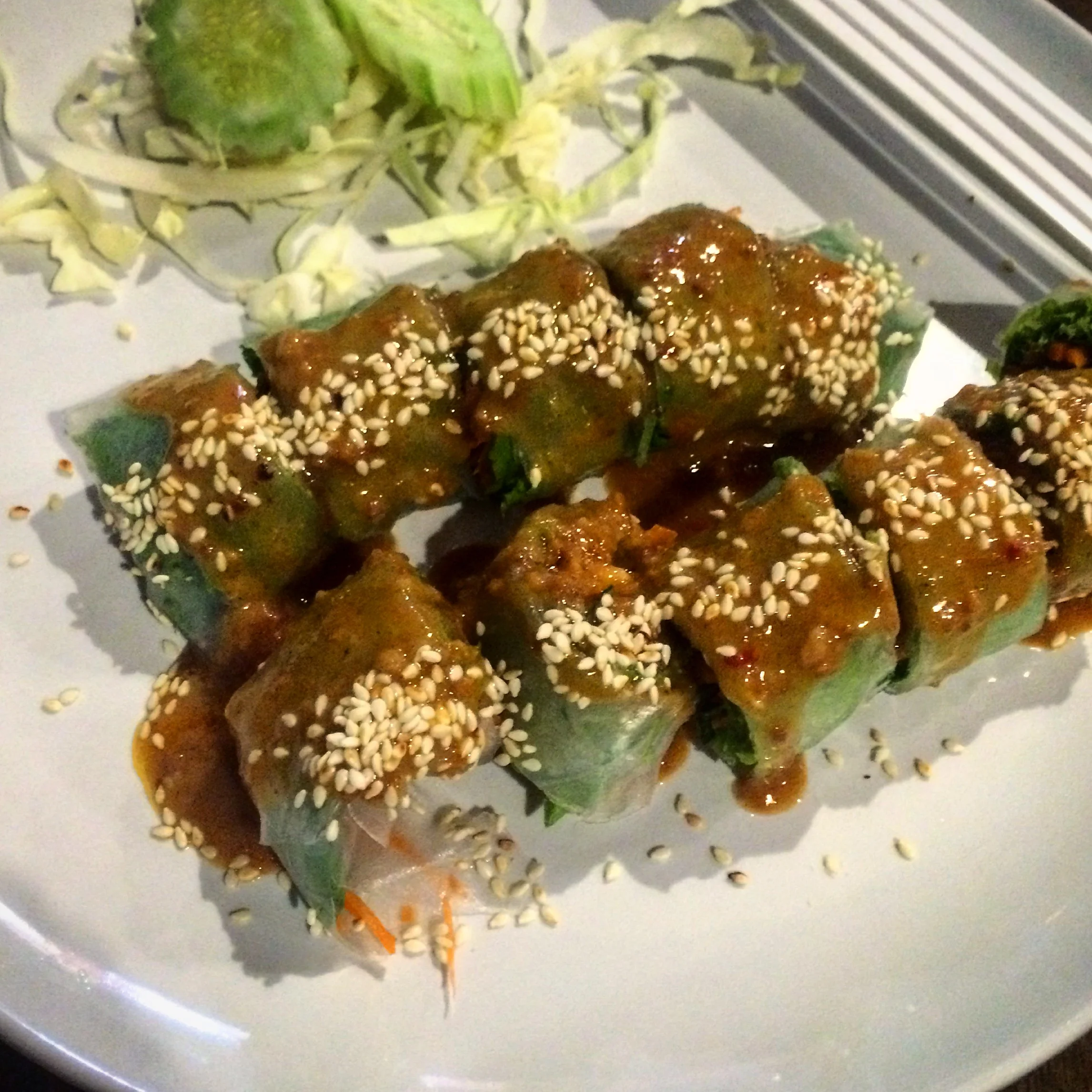 Fresh spring roll (poh pid tod) with veggies like sweet potato, celery, carrots, taro root & sesame seeds. Topped with tamarind sauce.