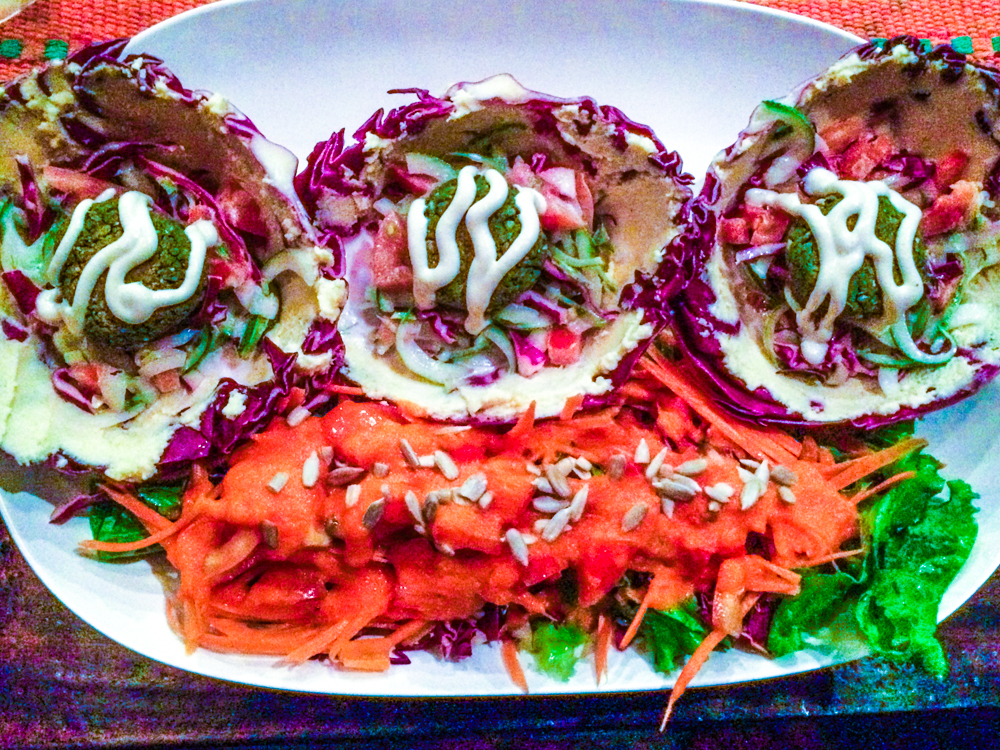 Baja Tacos - Cabbage wraps filled with mungbean falafel, coconut tzadziki sauce, and homemade hummus.