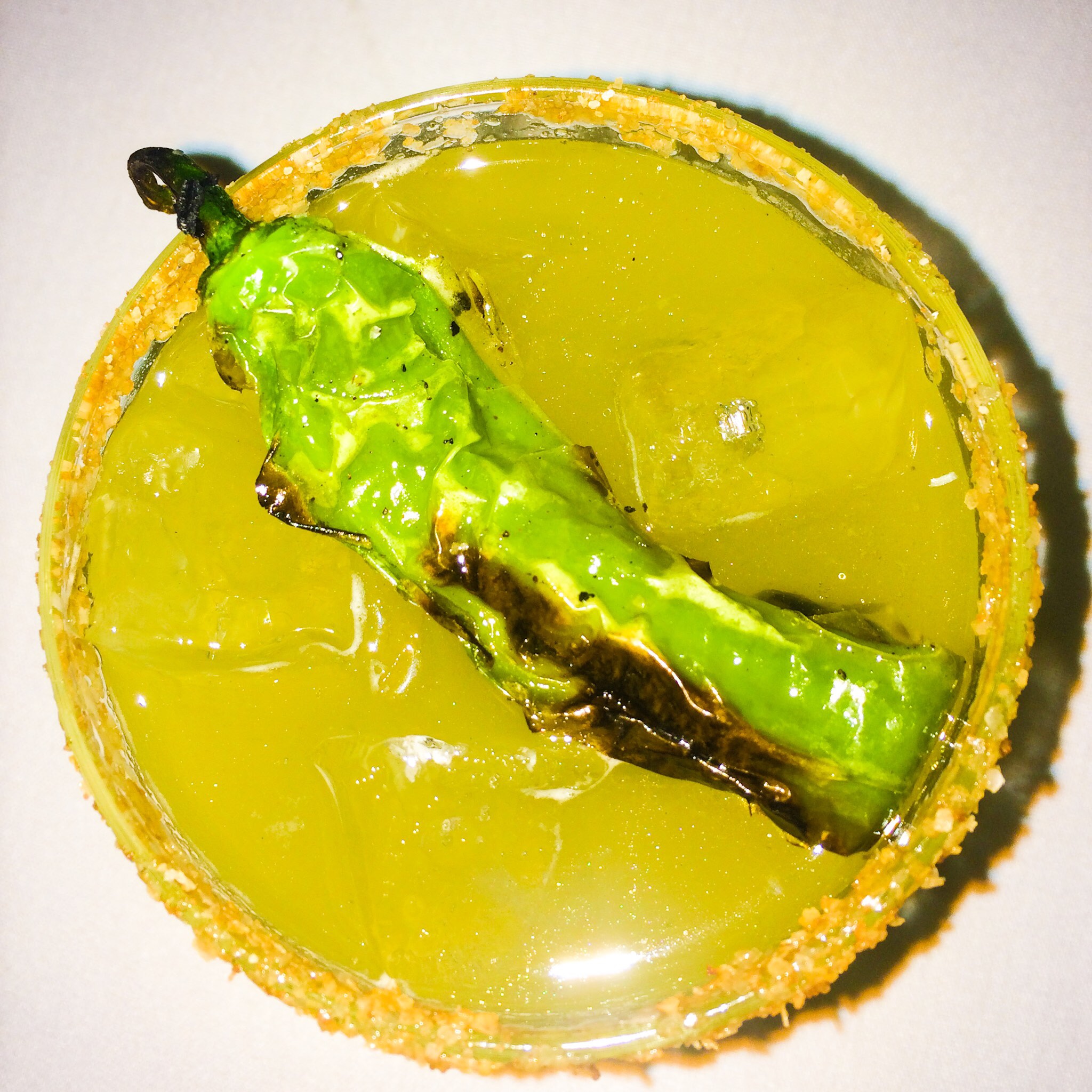 Look My Way - Del Maguey Mezcal, rum, basil, lime, firewater, tamari salt, and a blistered shishito pepper.