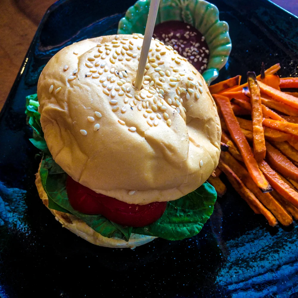 Super Yogi Burger: we chose the smokey beans patty, bell pepper, spinach, the whole grain bun & the vegan mayo. Sweet potato fries on the side, of course!