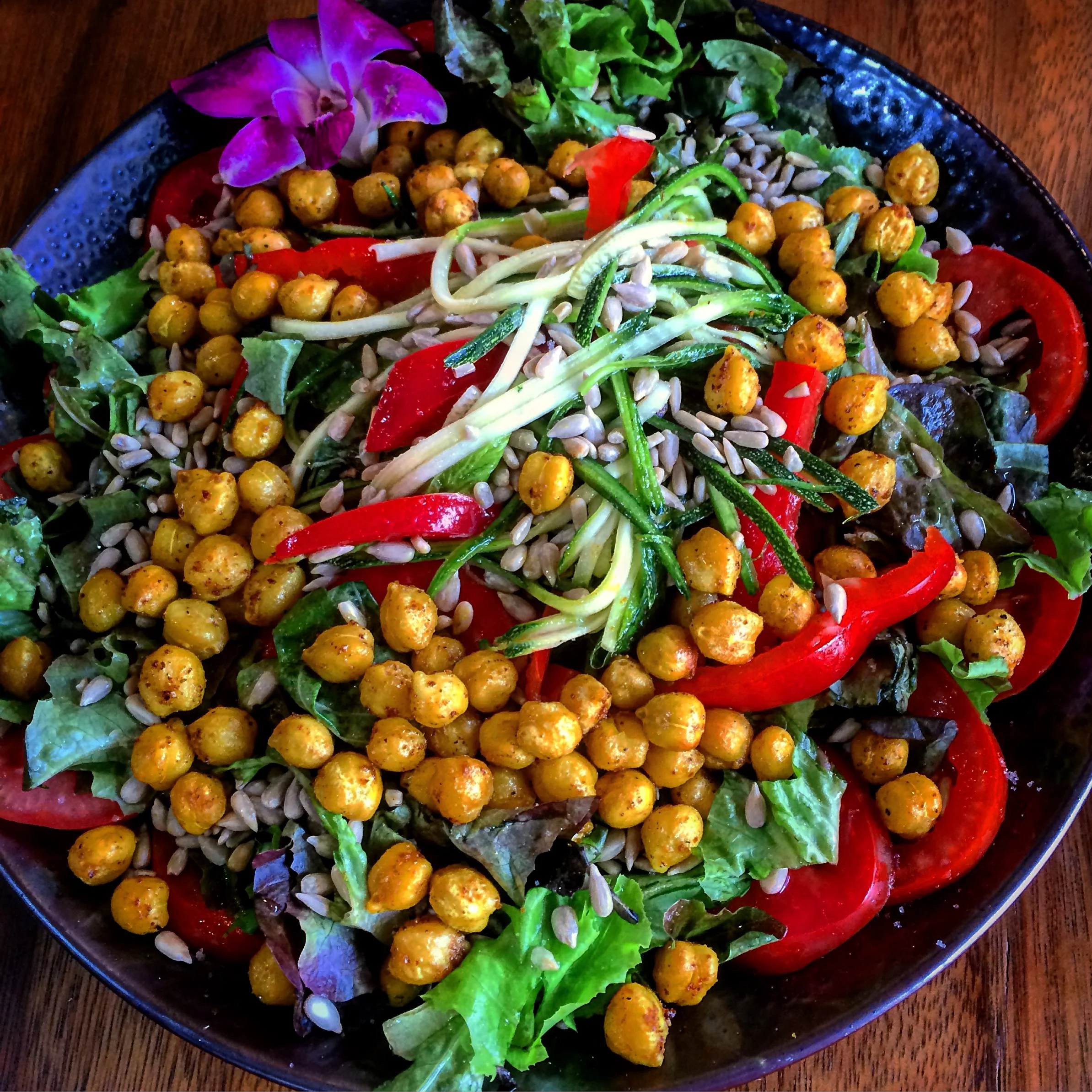 Create-a-Salad: Spinach, romaine, bell pepper, zucchini strands, tomato, garbanzo beans (spiced with cumin & curry), sunflower seeds, with olive oil and apple cider vinegar dressing. Best thing we ordered!