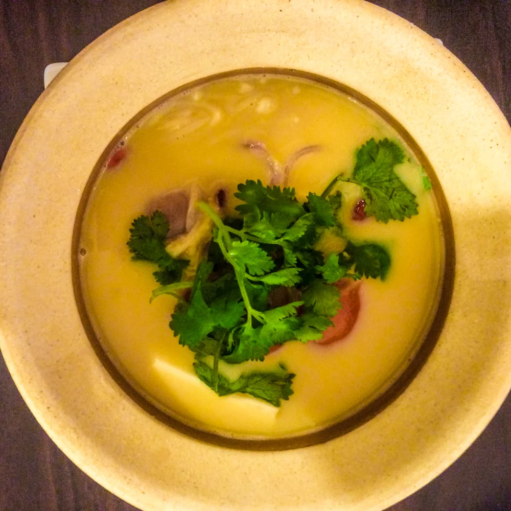 Coconut Soup (soft tofu, tomato, onion & mushroom cooked in coconut milk infused with lemongrass) from Veggie Bean in Koh Samui, Thailand.