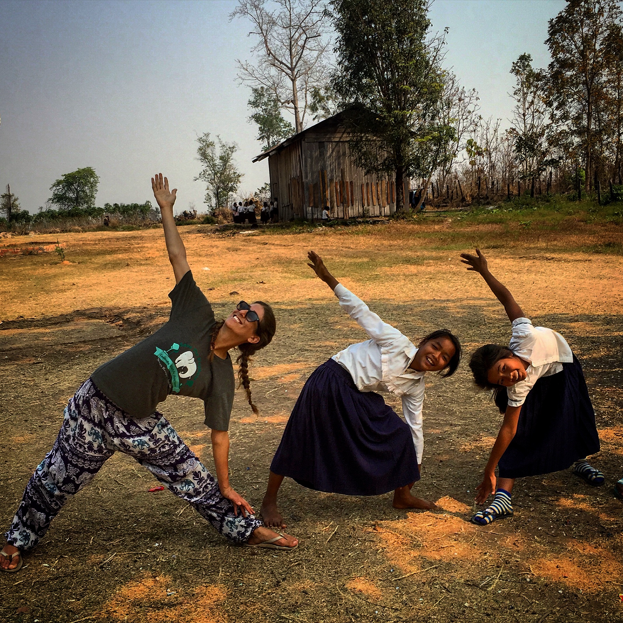 Teaching yoga to children in rural Cambodia.