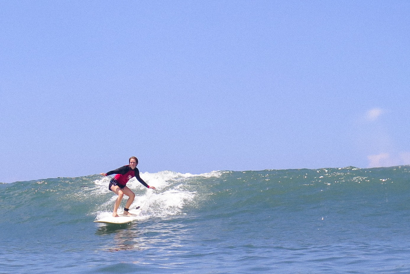 Katherine Plunkett catching a wave on the Serene Yoga Retreat in Canggu, Bali.