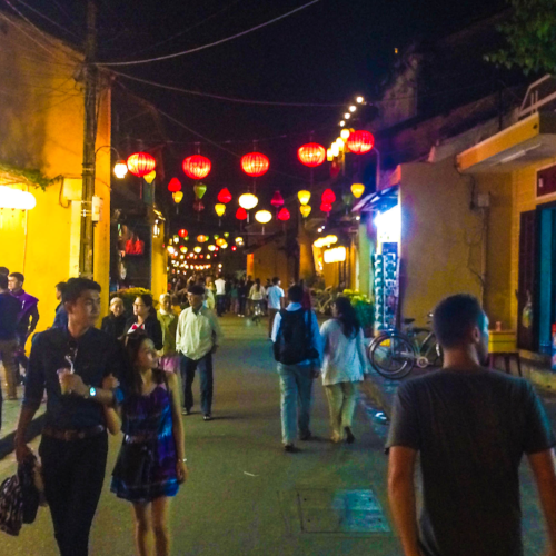 A street in Hội An at night.