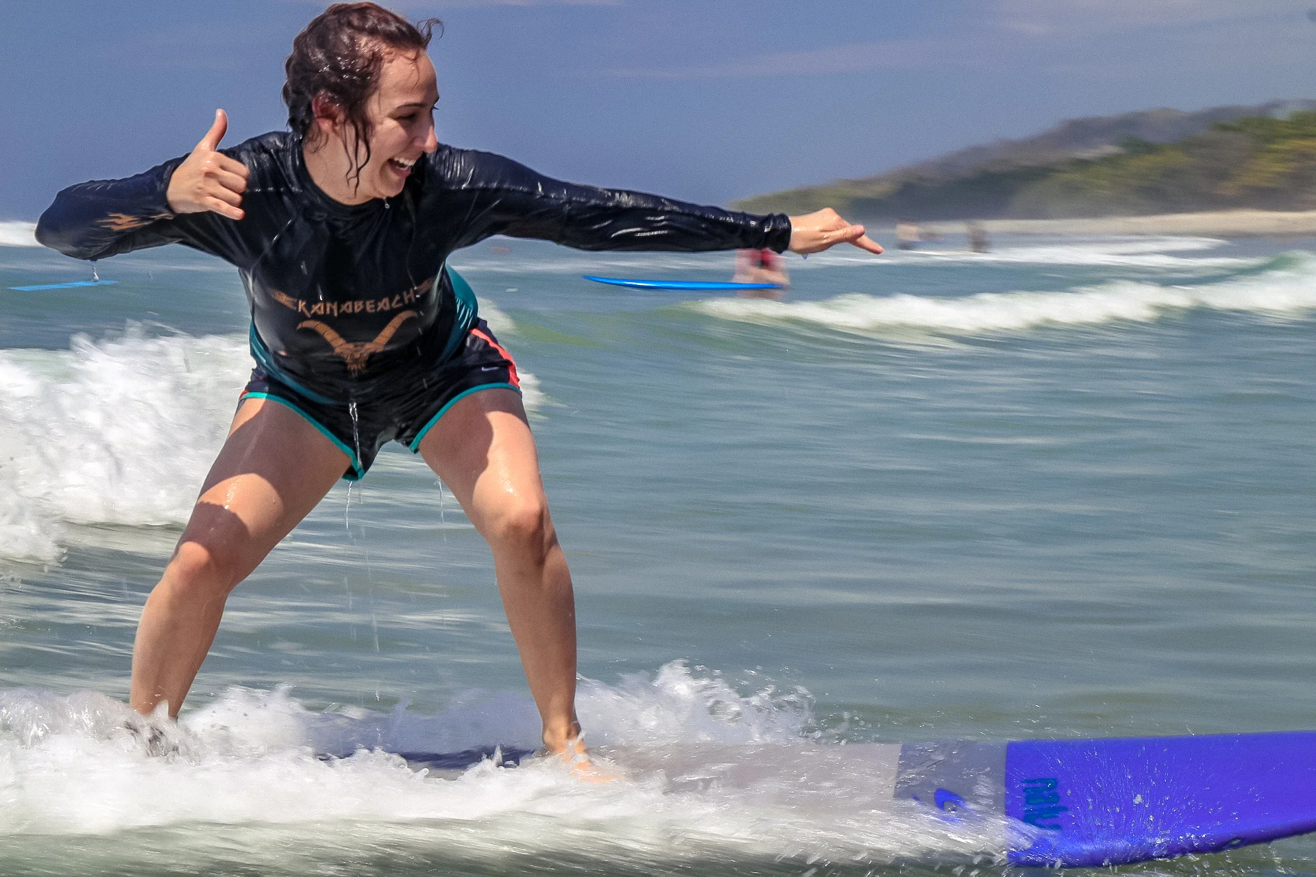 Jontea, our guest, catching waves on her first lesson in February 2019!