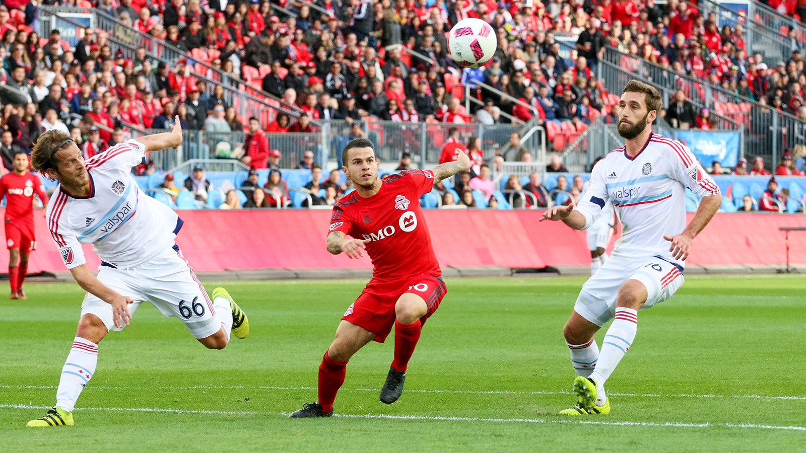 Toronto FC's Giovinco looking to keep the ball from two Chicago defenders. 