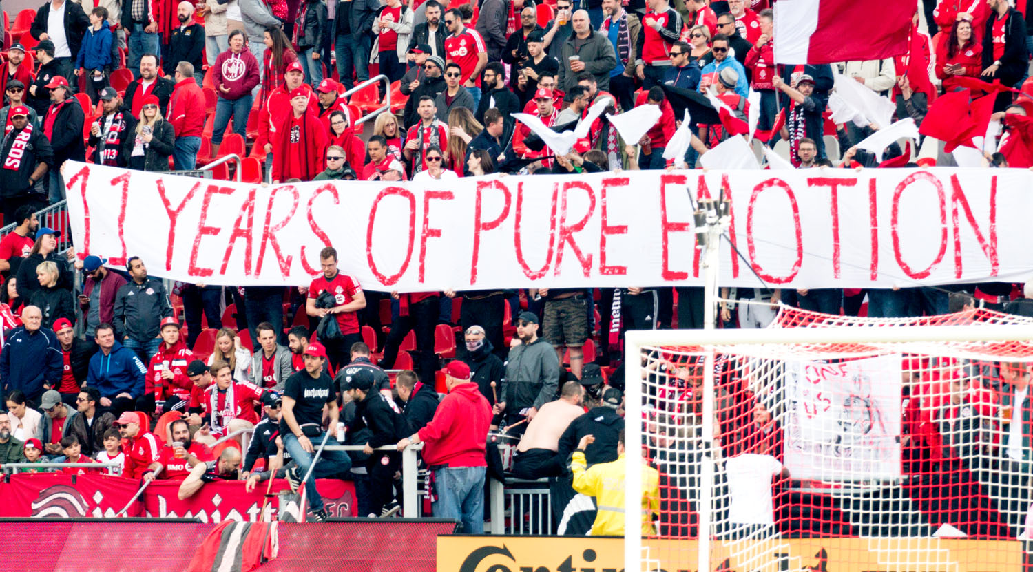 The '11 Years of Pure Emotion' banner is displayed in the South End Supporters Section at BMO Field. Image by Dennis Marciniak of denMAR Media.
