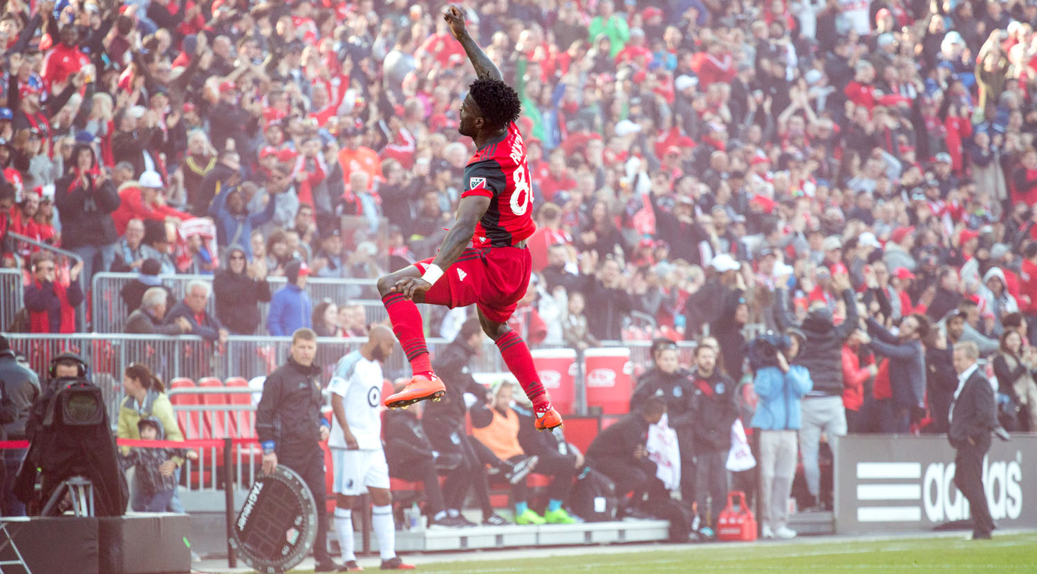 Tosaint Ricketts soaring through the air in celebration after a beautiful header to take Toronto FC to 3 goals and the win over Minnesota United FC. Image by Dennis Marciniak of denMAR Media.