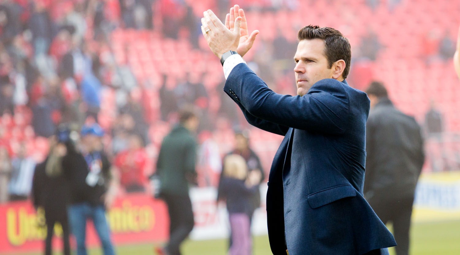 Greg Vanney clapping towards the south end fans after a vicotry over Minnesota United at BMO Field. Image by Dennis Marciniak of denMAR Media.