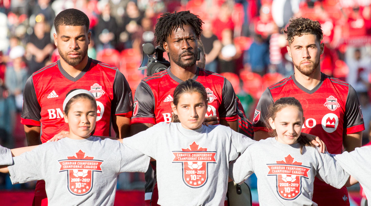 Jordan Hamilton, Tosaint Ricketts, and Jonathan Osorio line up for the Canadian National Anthem during a Canadian Championship game in 2017. Jonathan Osorio. Image by Dennis Marciniak of denMAR Media.