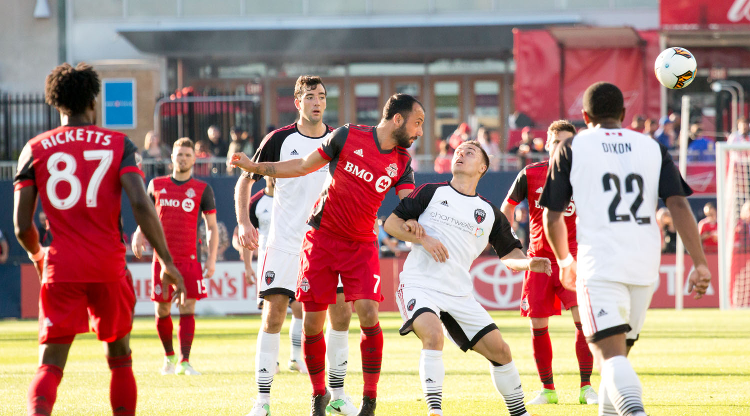 Víctor Vázquez heads the ball onward during a Canadian Championship game in May 2017. Image by Dennis Marciniak of denMAR Media.