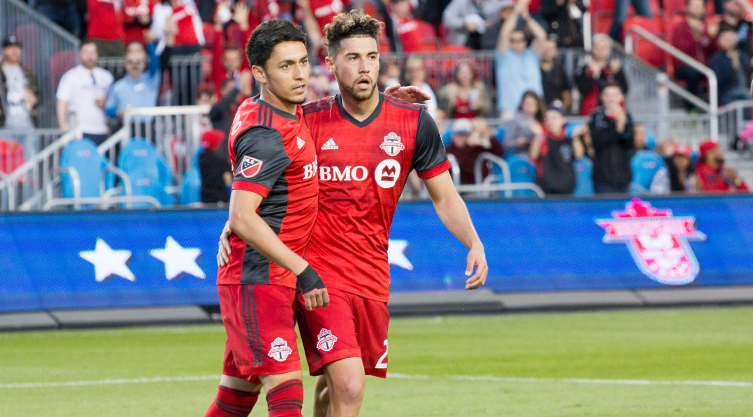 Marco Delgado and Tsubasa Endoh celebrate another Toronto FC goal. Image by Dennis Marciniak of denMAR Media.