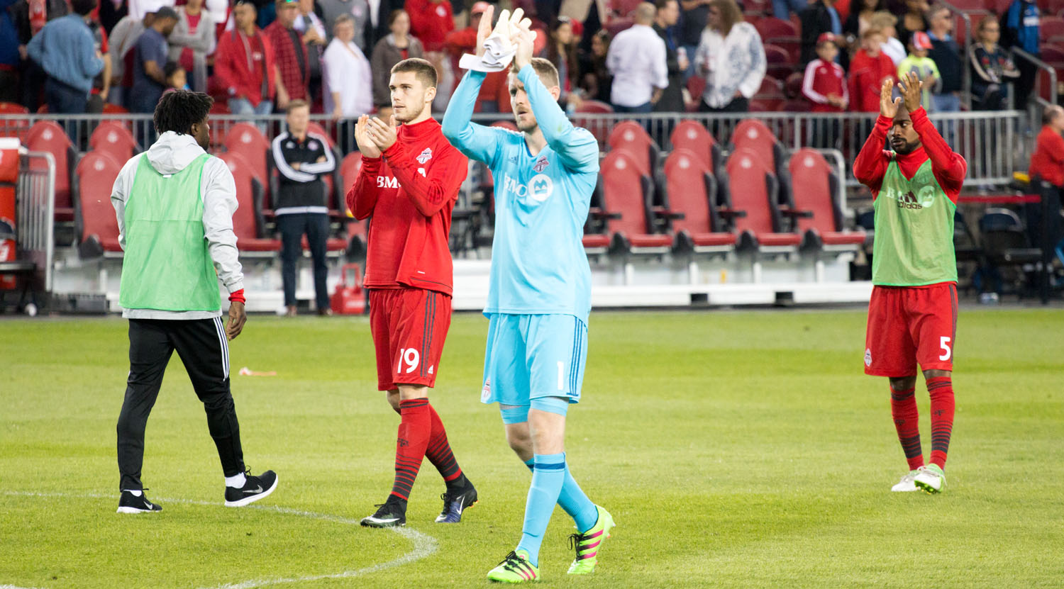 Clint Irwin (with the clean sheet) thanks the south end supporter's section after the conclusion of a Toronto FC match in which the team would score 4 goals. Image by Dennis Marciniak of denMAR Media.