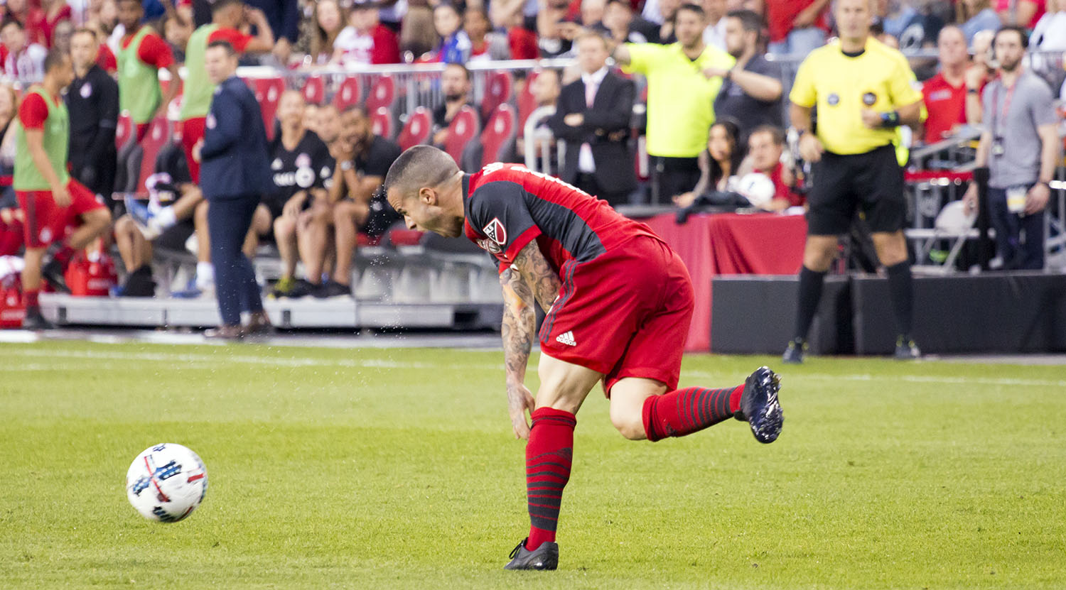 Sebastian Giovinco slams the ball into the ground during a match against DC United in 2017. Image by Dennis Marciniak of denMAR Media.