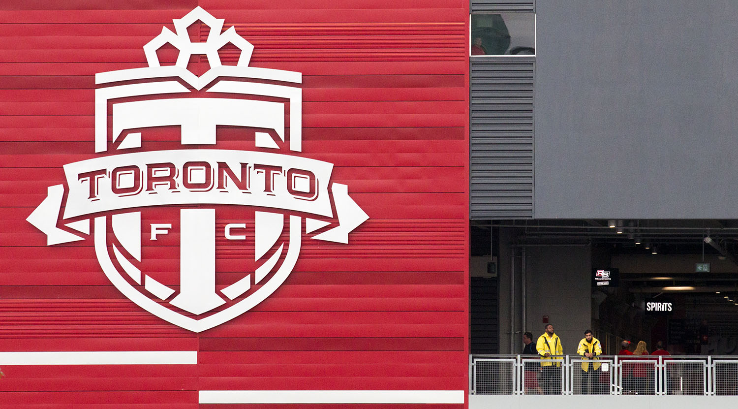 Security Guards watch over the crowds at BMO Field. Image by Dennis Marciniak of denMAR Media.