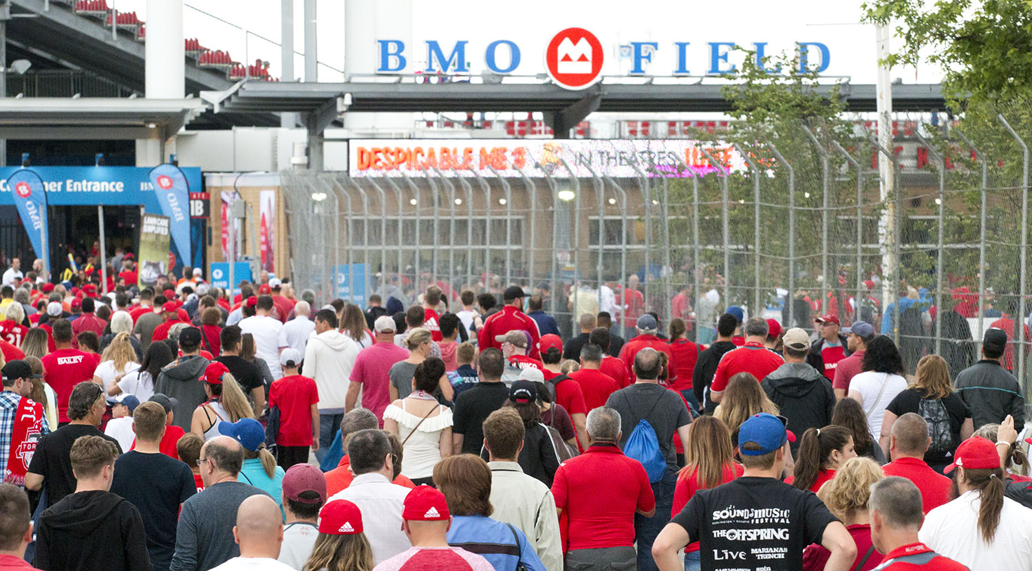 Fans pile into BMO Field on a warm summer night in Toronto for a Toronto FC match against the New England Revolution. Image by Dennis Marciniak of denMAR Media.