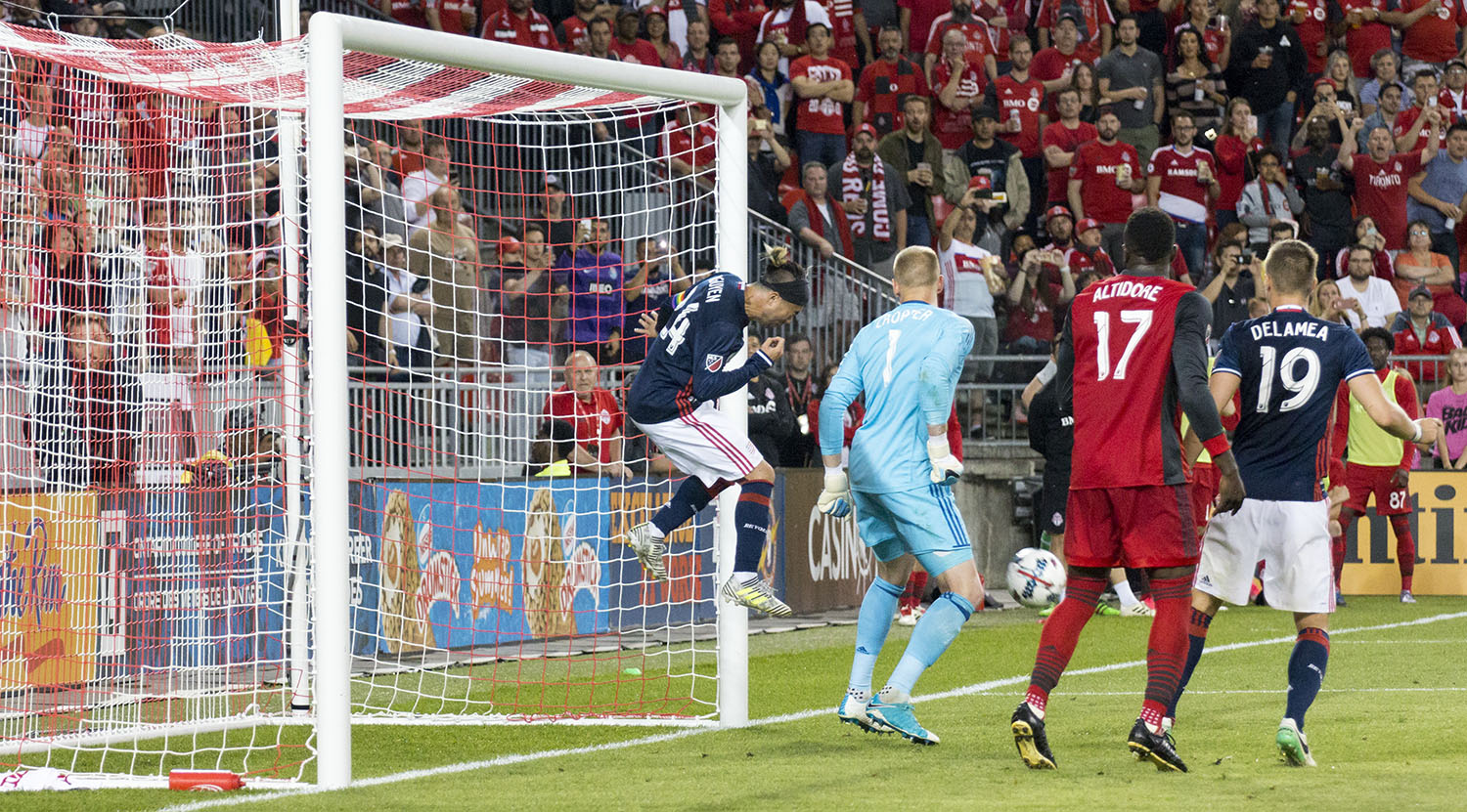 Lee Nguyen heads the ball out of danger and away from the goal line after a Toronto FC free kick. Image by Dennis Marciniak of denMAR Media.