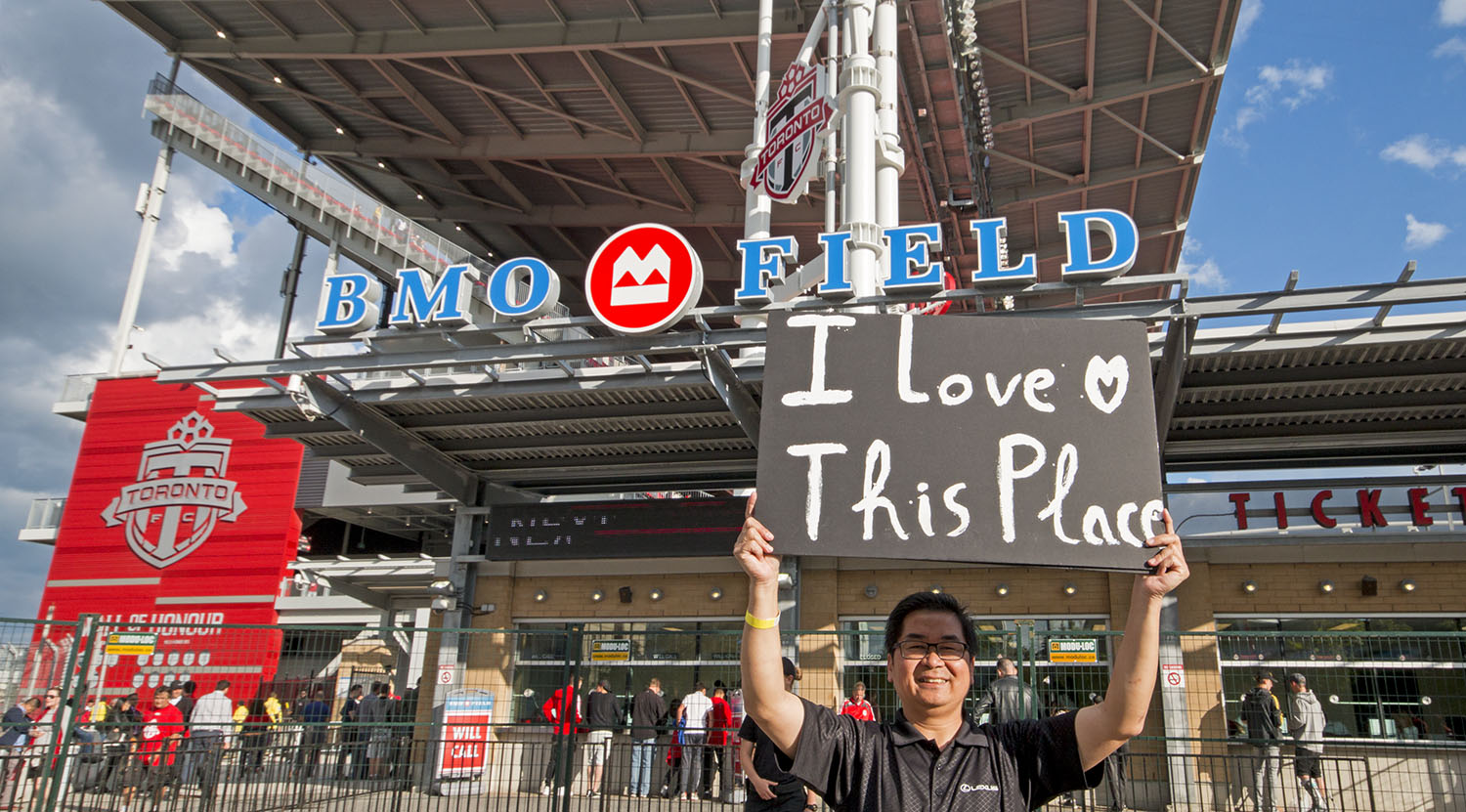 Does anyone know who this is? The week before he had a sign saying that it was his first game and now he has a sign that says, 'I love this place'. Image by Dennis Marciniak of denMAR Media.