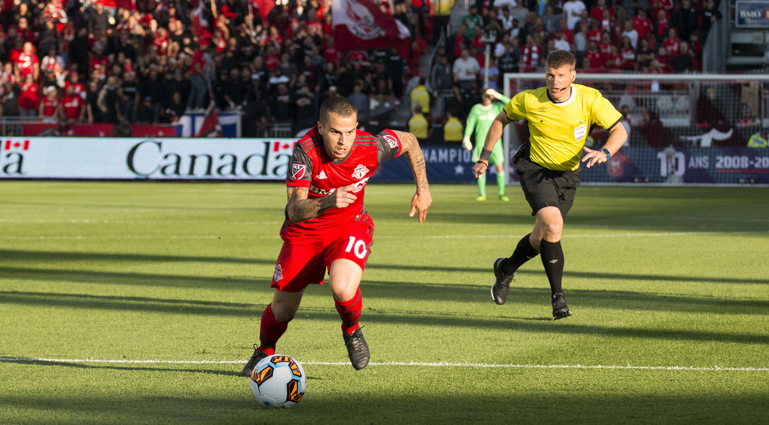 Sebastian Giovinco drives the ball down the field with brilliant pace during the Canadian Championship finale in 2017. Image by Dennis Marciniak of denMAR Media.