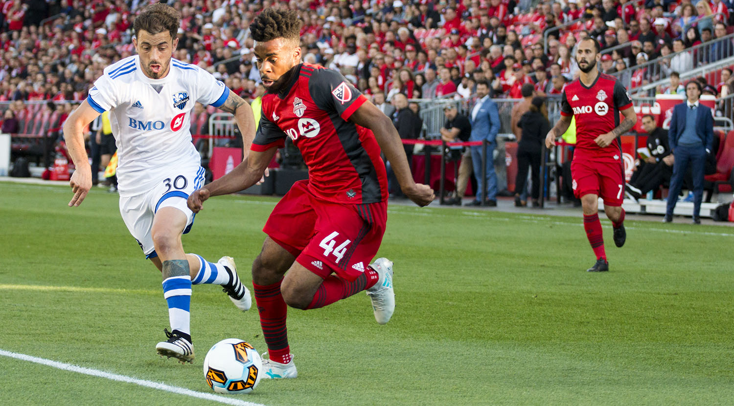 Raheem Edwards takes the ball past a Montreal Impact defender at the Canadian Championship finale in 2017. Image by Dennis Marciniak of denMAR Media.