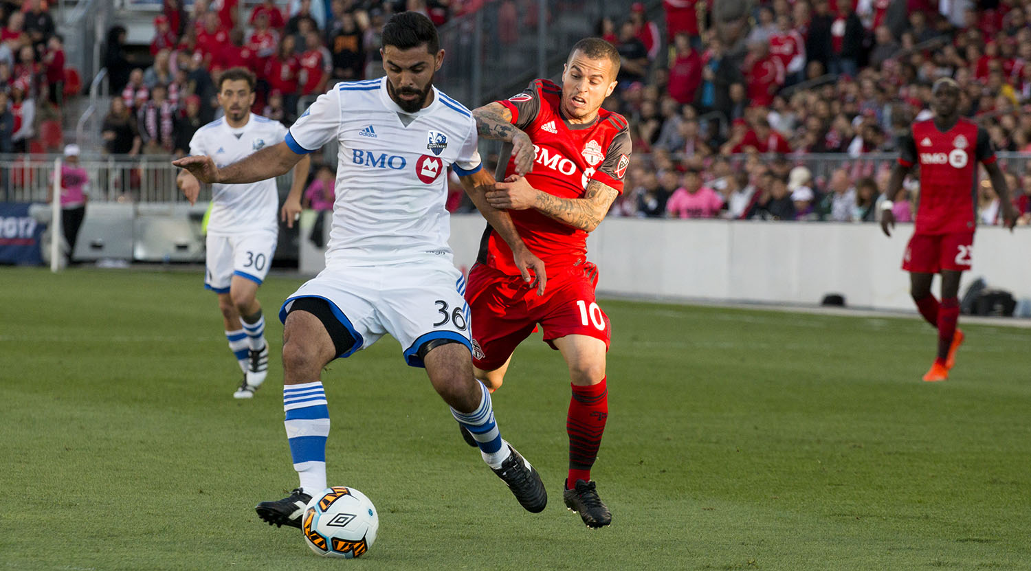 Victor Cabrera tries to get the ball away from Sebastian Giovinco during the Canadian Championship finale in 2017. Image by Dennis Marciniak of denMAR Media.