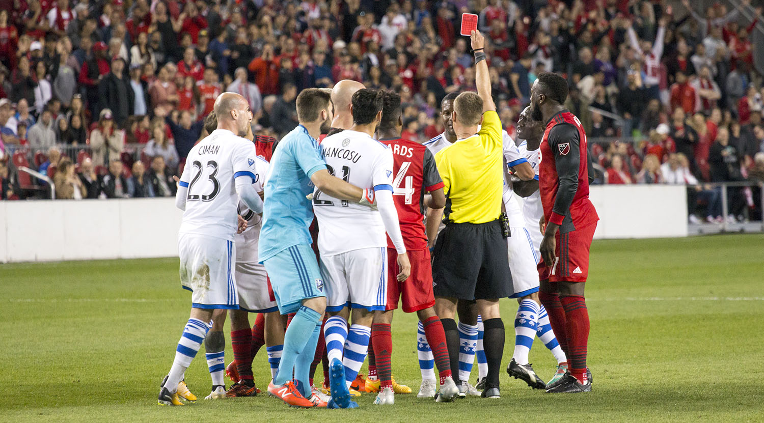 The first official issuing a red card to a Montreal Impact player in the second half of the second leg of the Canadian Championship Final. Image by Dennis Marciniak of denMAR Media.