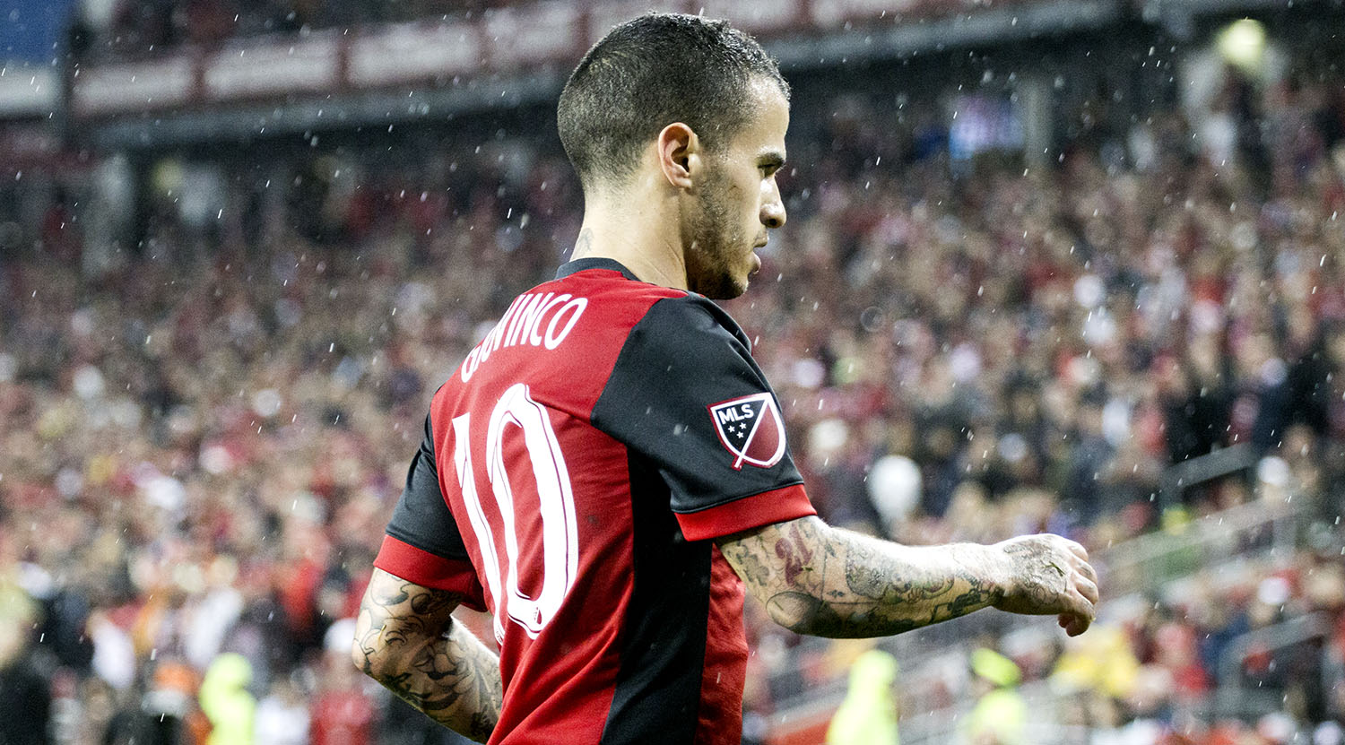 Sebastian Giovinco going to take a corner in the pouring rain at BMO Field in Toronto, Canada. Image by Dennis Marciniak of denMAR Media.