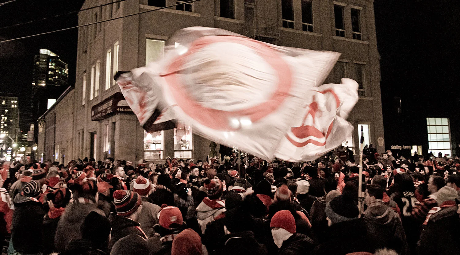 Toronto FC supporters gather in Liberty Village before the Eastern Conference Final match in 2017. Image by Dennis Marciniak of denMAR Media.