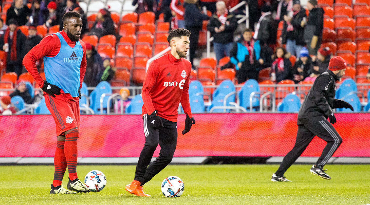 Jozy Altidore and Jonathan Osorio taking practice shots before a MLS playoff match in 2017 at BMO Field. Image by Dennis Marciniak of denMAR Media.