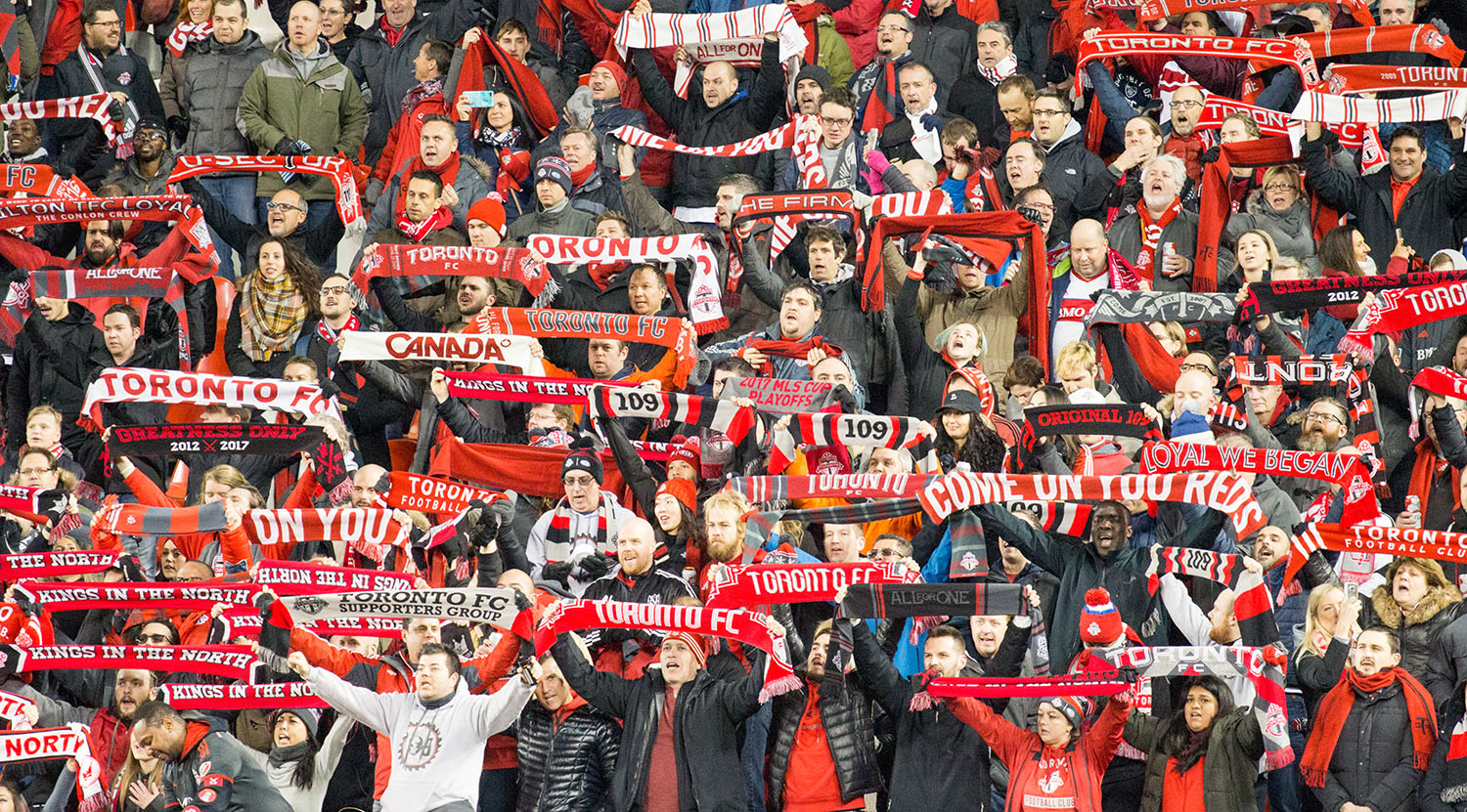 Toronto FC supporters in the south end of BMO Field raise the scarves up high during the national anthem on November 29, 2017. Image by Dennis Marciniak of denMAR Media.