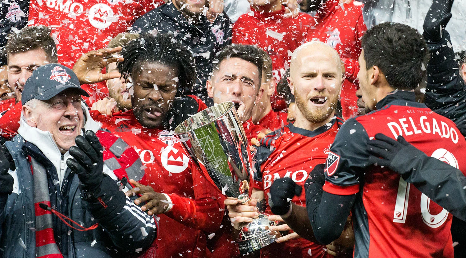 Toronto FC celebrating the advance to the 2017 Major League Soccer Finale with the Eastern Conference trophy. Image by Dennis Marciniak of denMAR Media.