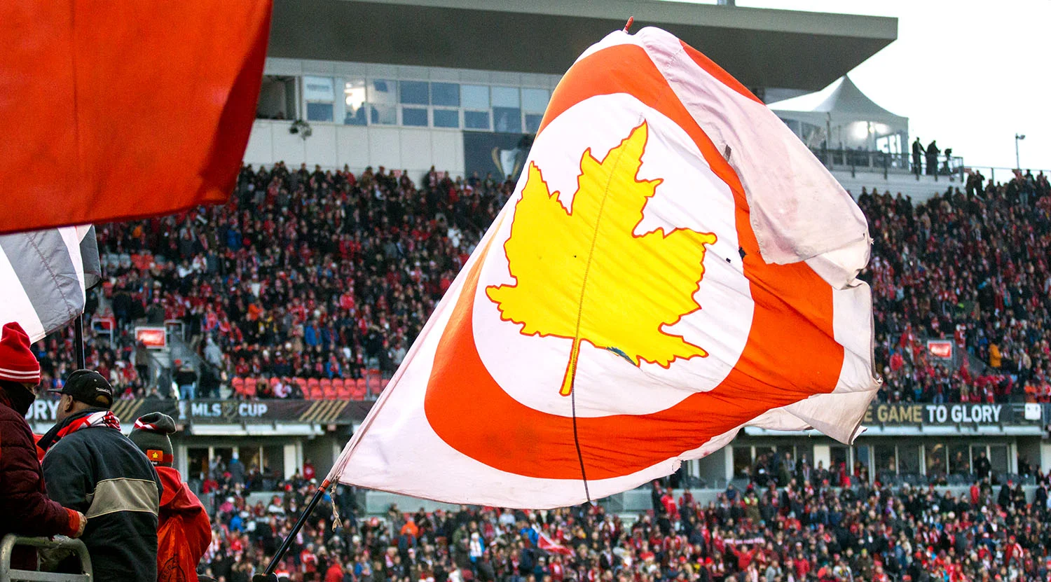 Red Patch Boys in the south end wave their flag during the MLS Cup 2017 playoffs. Image by Dennis Marciniak of denMAR Media.