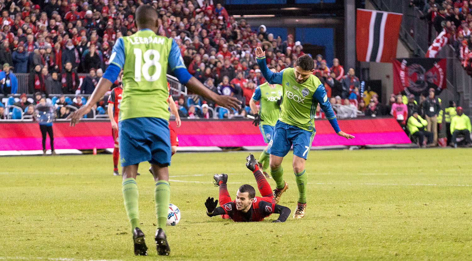 Sebastian Giovinco taken down to ground during the 2017 MLS Cup Playoffs. Image by Dennis Marciniak of denMAR Media.