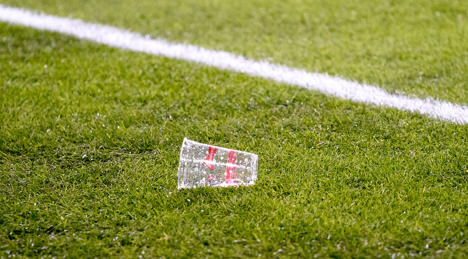 A beer thrown onto the pitch at BMO Field during the Major League Soccer Cup Final. Image by Dennis Marciniak of denMAR Media.
