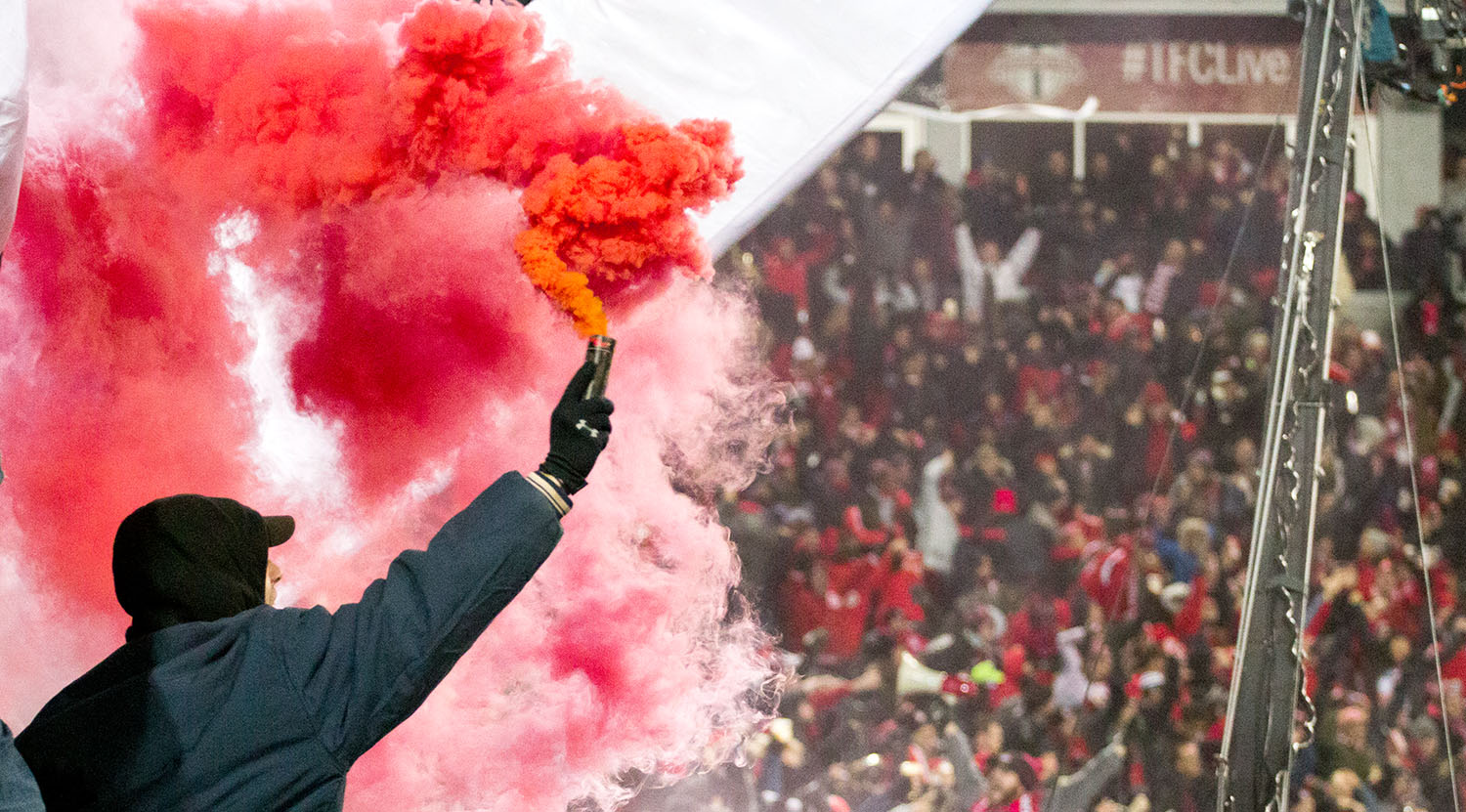 South End Supporter Groups light smoke up in celebration of the Jozy Altidore goal during the 2017 MLS Cup Playoffs at BMO Field in Toronto, Canada. Image by Dennis Marciniak of denMAR Media.