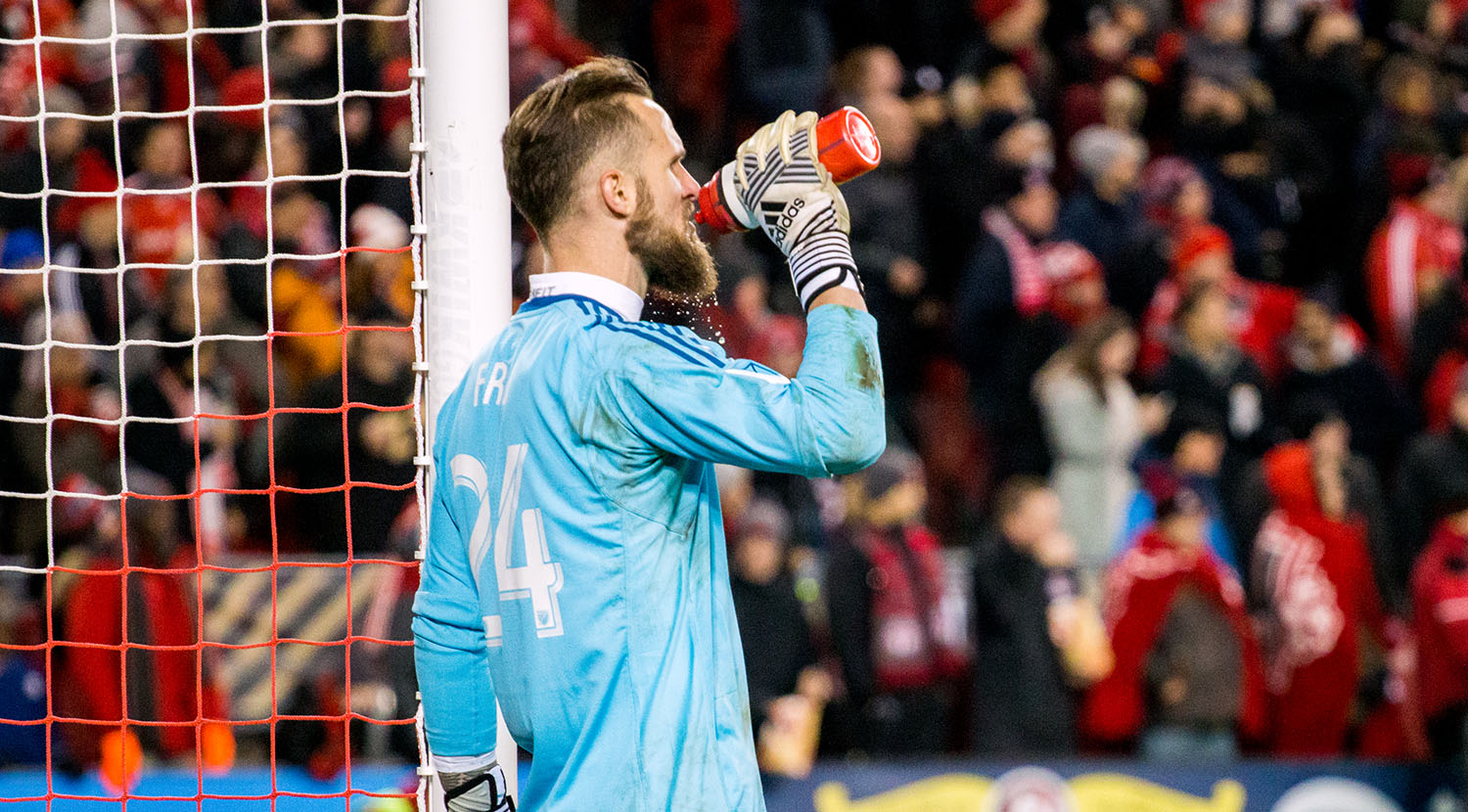 Stefan Frei takes a sip of water as it trickles through his beard during the 2017 MLS Cup playoffs at BMO Field. Image by Dennis Marciniak of denMAR Media.