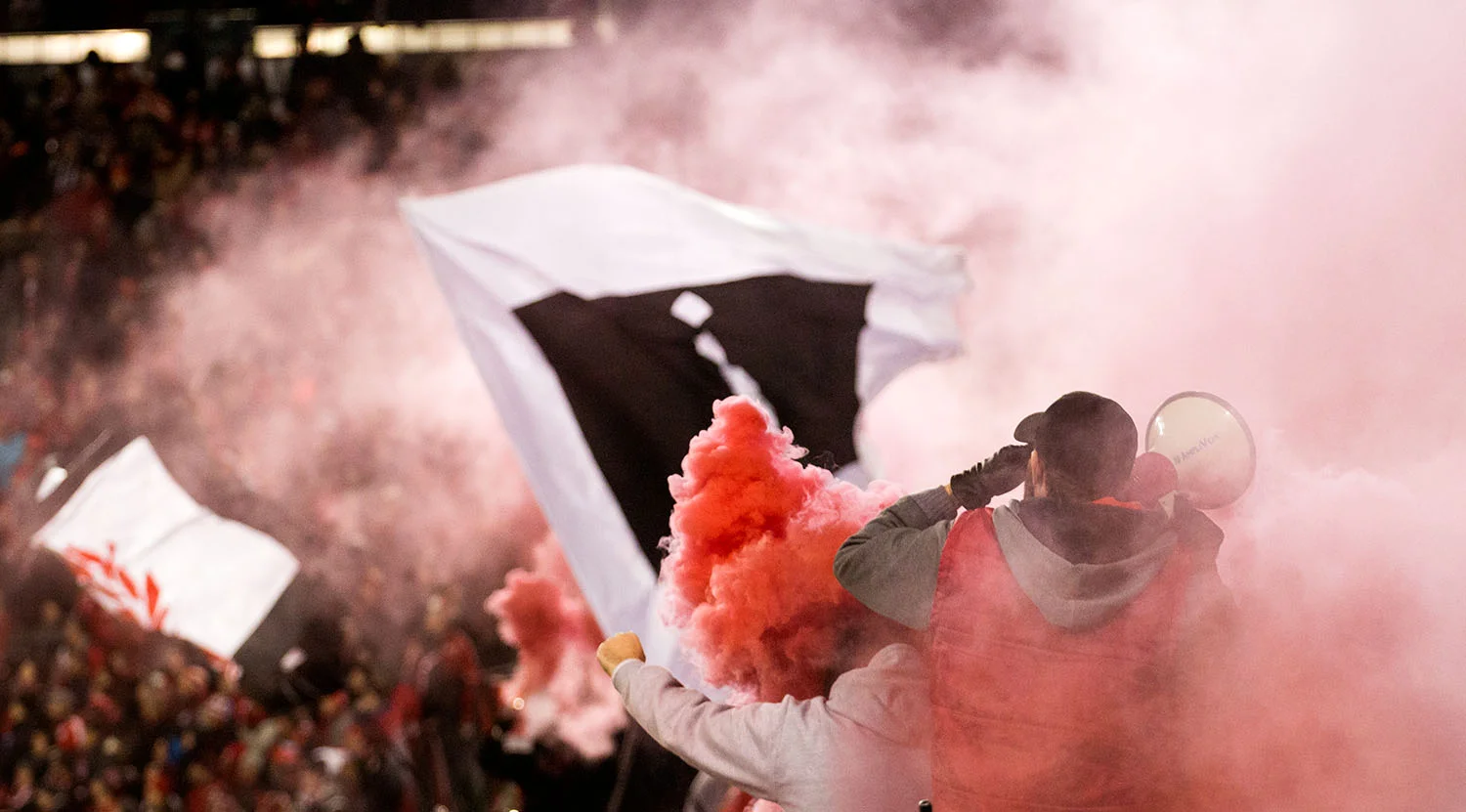 Smoke fills BMO Field from the south end supporters' section as the second insurance goal is scored. Image by Dennis Marciniak of denMAR Media.