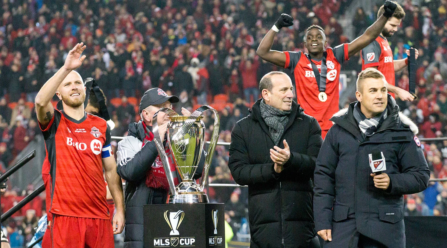 Michael Bradley, Don Garber and Taylor Twellman await the trophy presentation after the 2017 MLS Cup final whistle is blown. Image by Dennis Marciniak of denMAR Media.