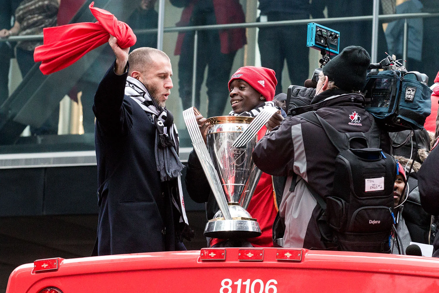 Toronto FC players celebrate with the trophy during the Toronto FC 2017 MLS Cup Parade. Image by Dennis Marciniak of Denmar Media.