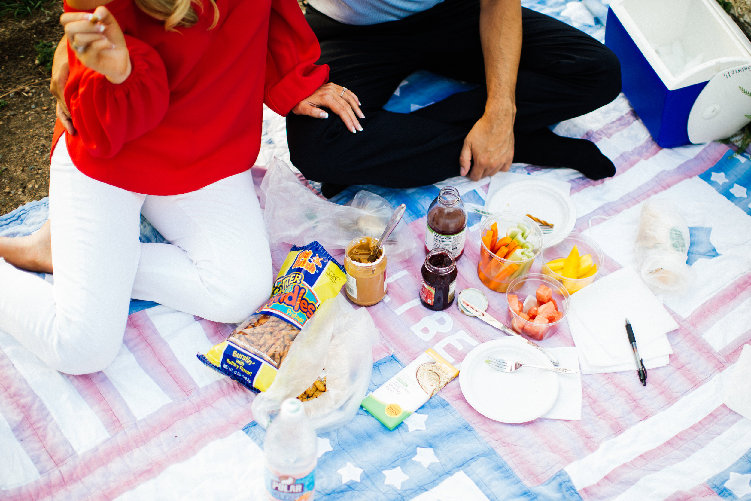 cute couple having a picnic for their romantic minneapolis engagement session