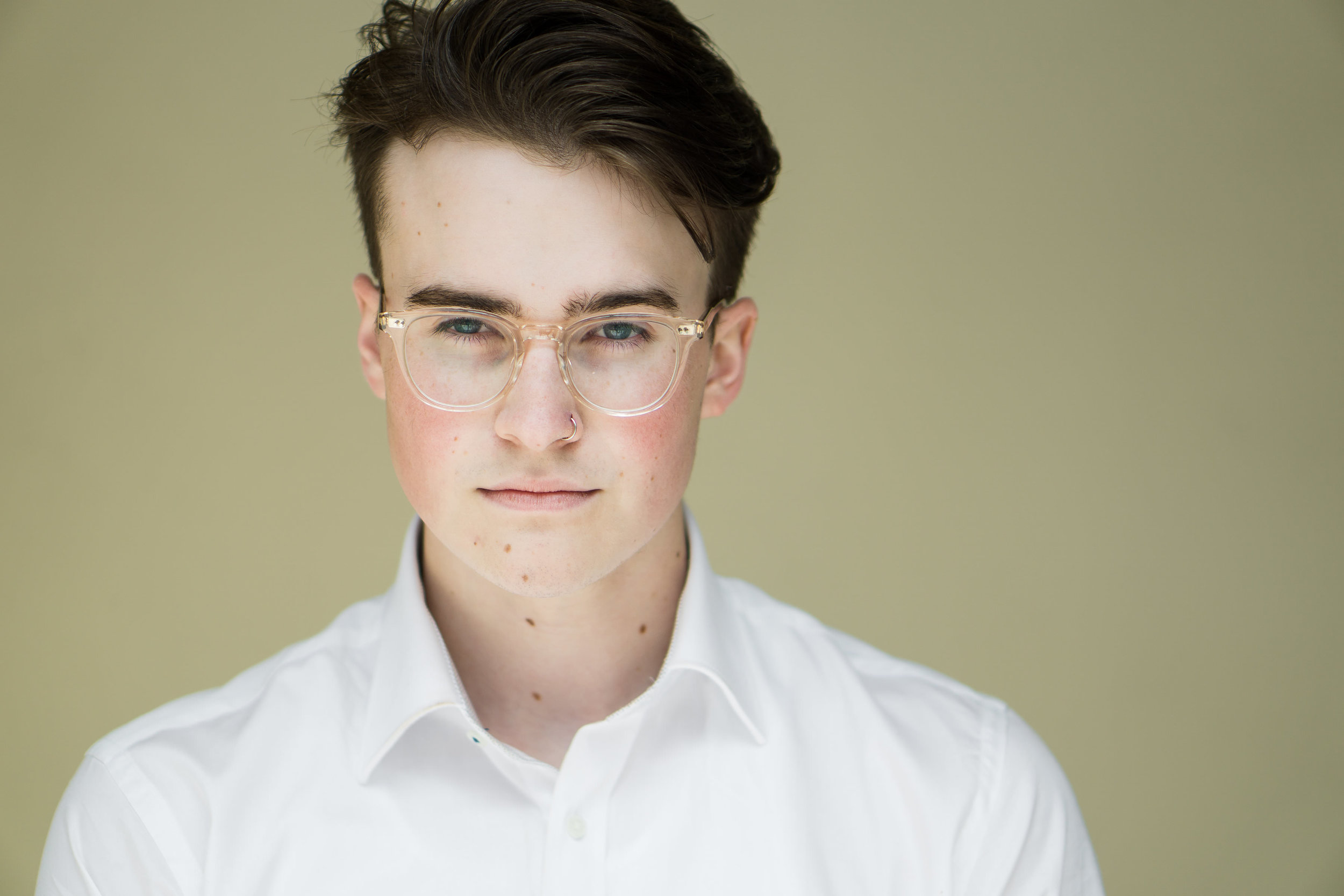 actor with glasses headshot