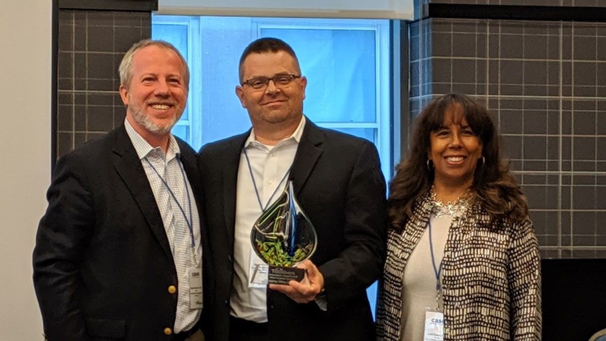 Aaron Sarber from IOS receiving Solution of the Year Award.