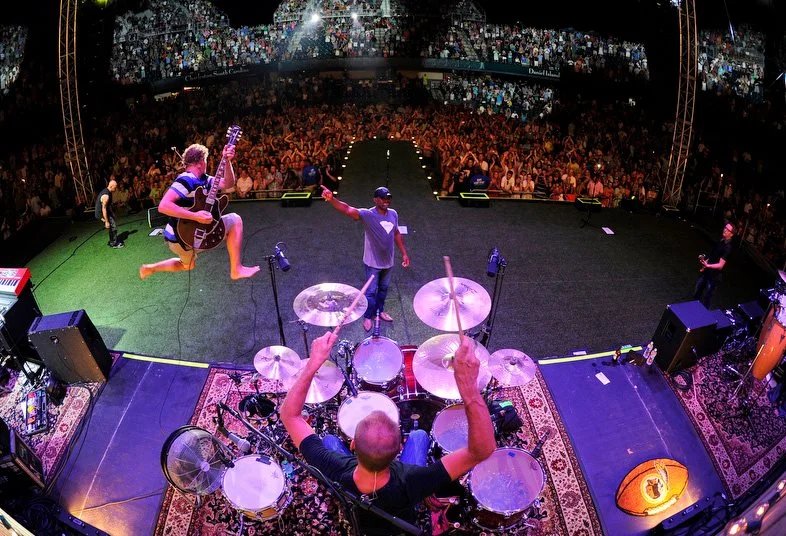 Mark Bryan (mid-air) with Hootie & the Blowfish