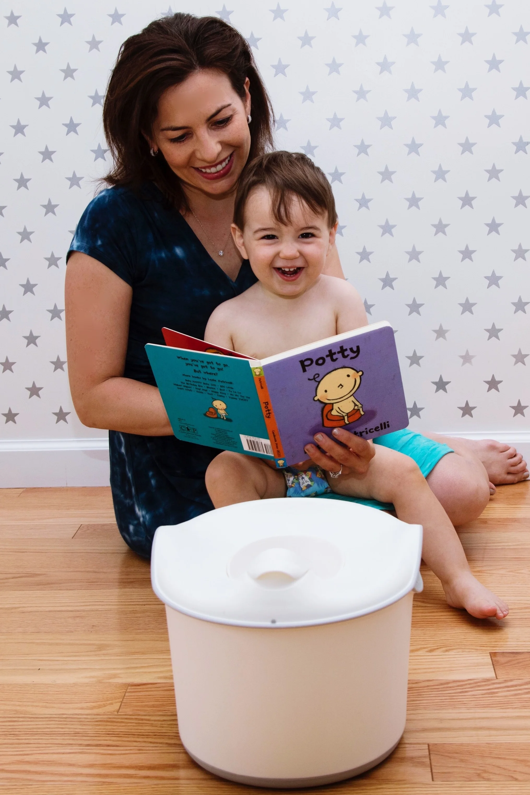 First time seeing the potty and reading the potty book . 
