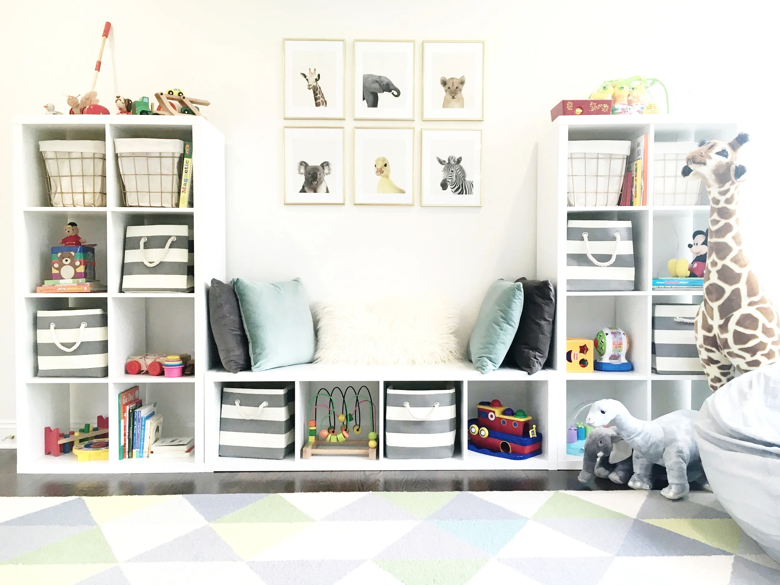 Image courtesy of Pinterest (click here to browse the IKEA Kallax collection). See below for bin options.