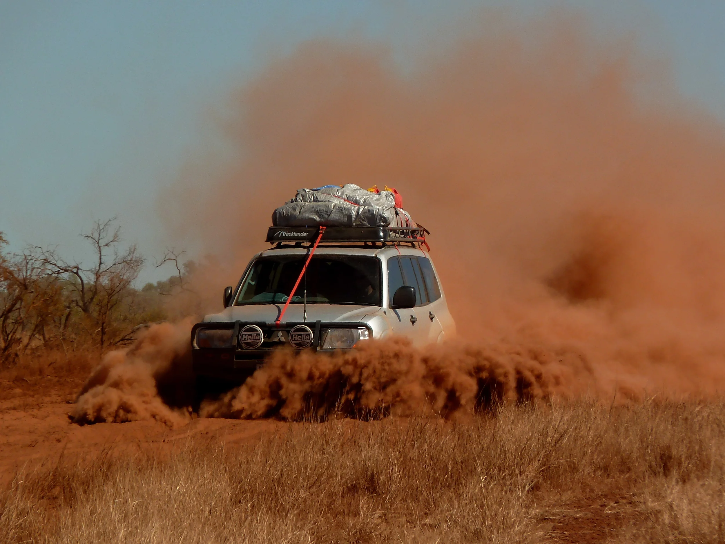 Parting shot... us driving through bull dust. Some of my things are still stained from that red dust! Photo credit: Gerzy 