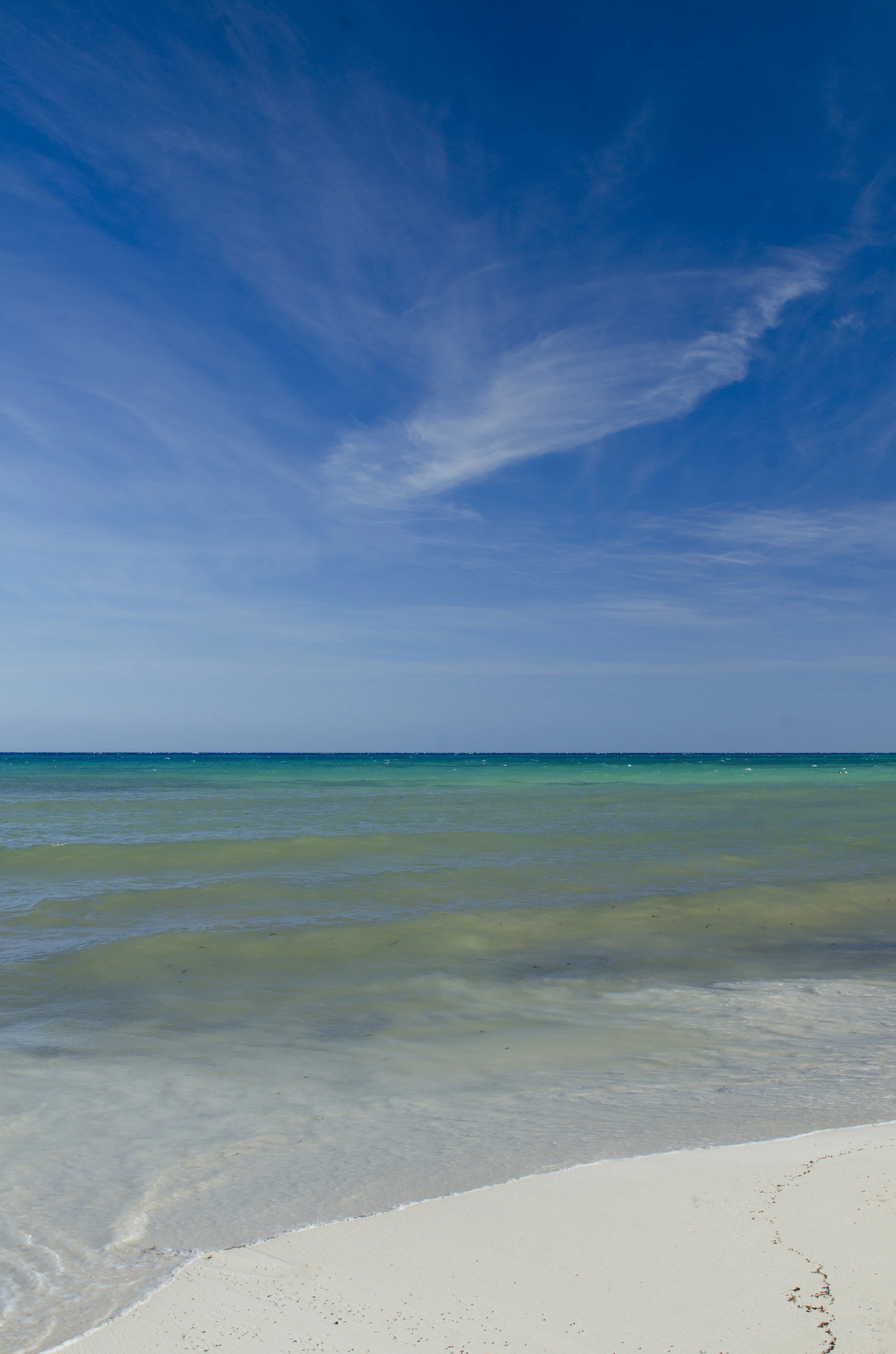I still thought the beach was beautiful even after the storm brought in some seaweed and reduced the clarity of the water