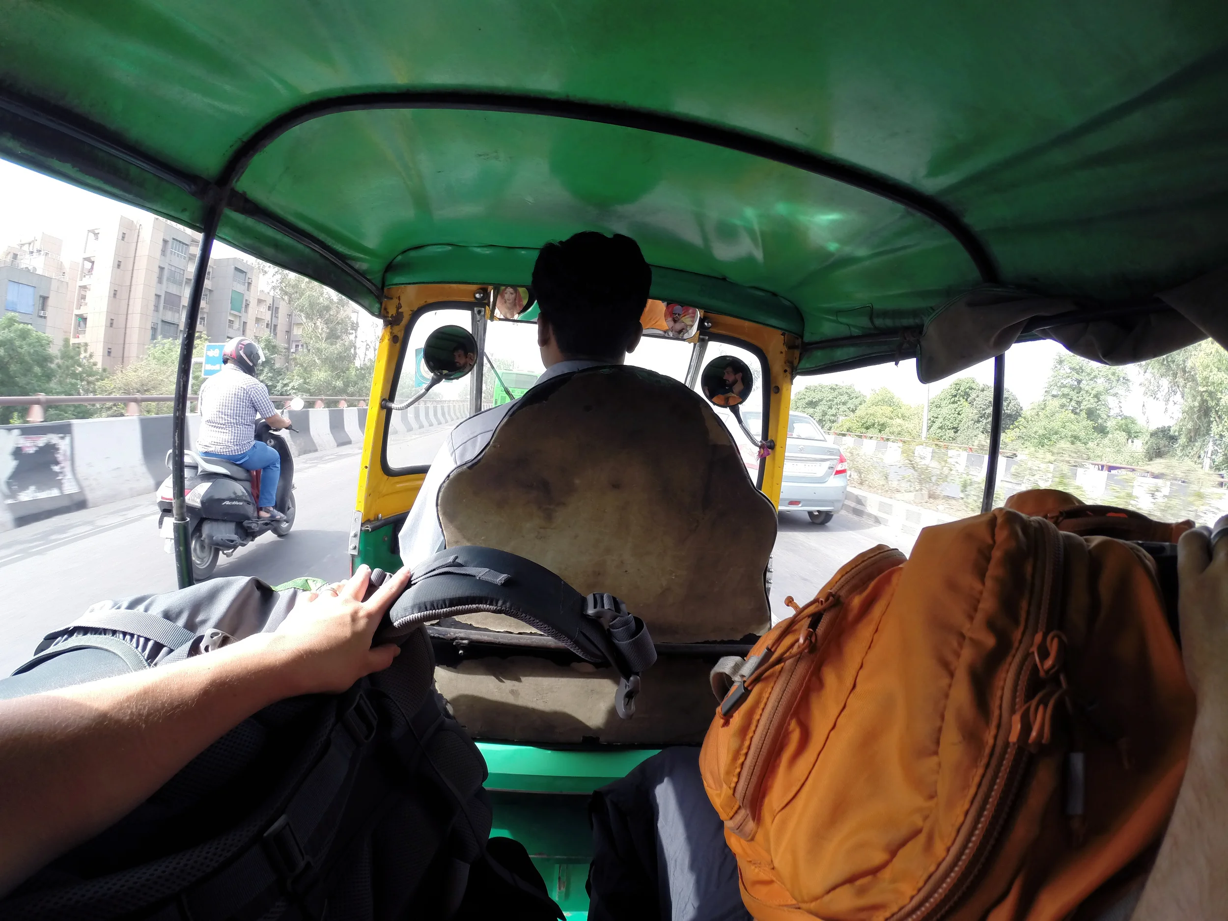 Taking a rickshaw across Delhi from the metro station to our hotel